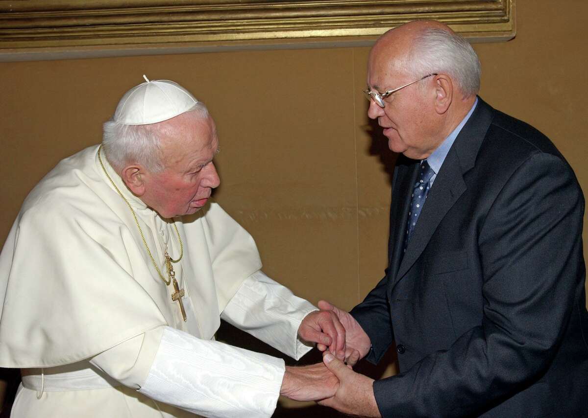 Pope John Paul II greets former Soviet President Mikhail Gorbachev during a private meeting at the Vatican on Oct. 19, 2002. Gorbachev was in Rome for the Third World Nobel Peace Summit and visited with the pope, who died three years later. Gorbachev died Aug. 30.