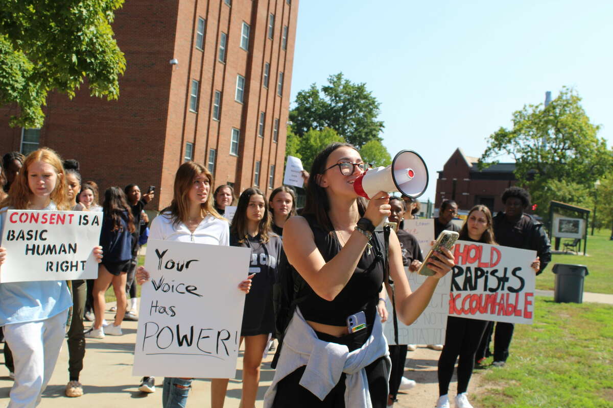 About 100 students marched through Central Connecticut State University Friday to call for action after a video on TikTok accused a student of sexual assault.
