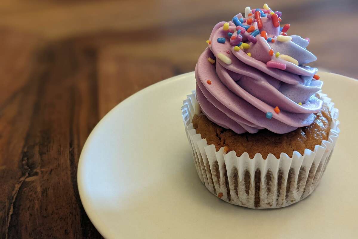 The rainbow coconut cupcake at Wholesome Bakery.