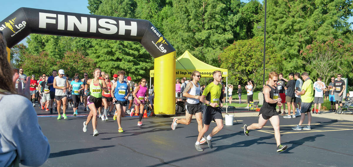Runners cross the finish line during last year’s Cougars Unleashed Homecoming Run & Pancake Breakfast at SIUE. This year’s race is scheduled for 8 a.m. Saturday.