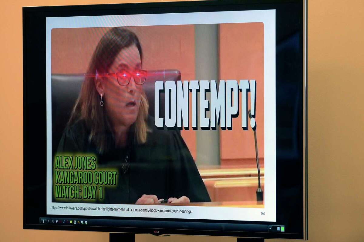 A photograph from evidence, showing Superior Court Judge Barbara Bellis, that was posted on one of Infowars’ websites is displayed on a video screen during the Alex Jones Sandy Hook defamation damages trial in Superior Court in Waterbury, Connecticut, Friday, September 16, 2022. H John Voorhees III / Hearst Connecticut Media.