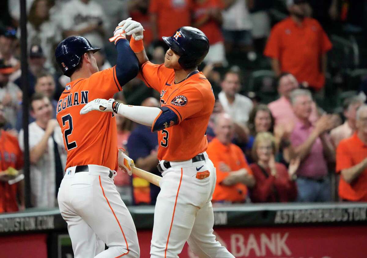 Houston Astros Jeremy Peña (3) celebrates with Alex Bregman after hitting a home run against Oakland Athletics starting pitcher Adrian Martinez during the fifth inning of an MLB baseball game at Minute Maid Park on Friday, Sept. 16, 2022 in Houston.