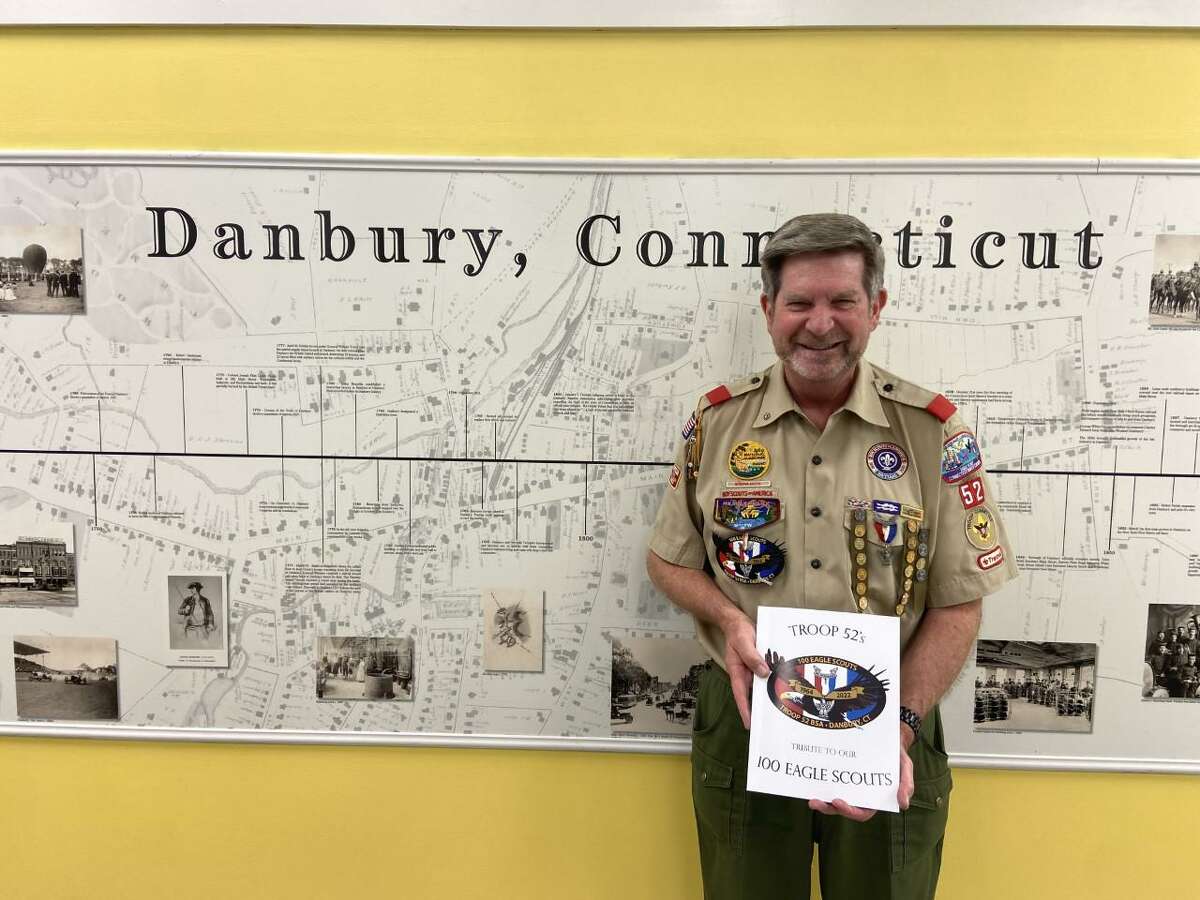 State Rep. Ken Gucker, D-Danbury, and Rick Rogers, from Danbury's Boy Scout Troop 52, recently visited the Danbury Museum and Historical Society to donate a volume celebrating Troop 52’s 100 Eagle Scouts.