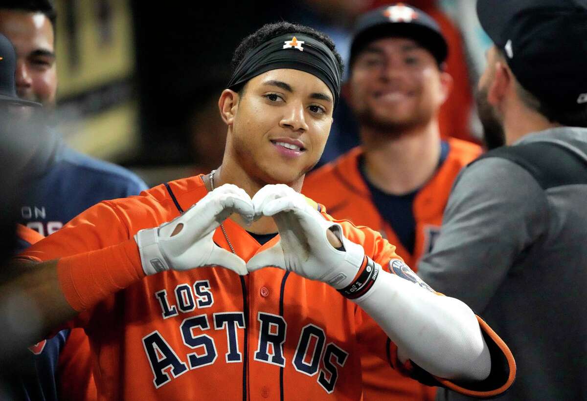 Houston Astros Jeremy Peña (3) flashes a heart sign in the dugout after hitting a home run against Oakland Athletics starting pitcher Adrian Martinez during the fifth inning of an MLB baseball game at Minute Maid Park on Friday, Sept. 16, 2022 in Houston.