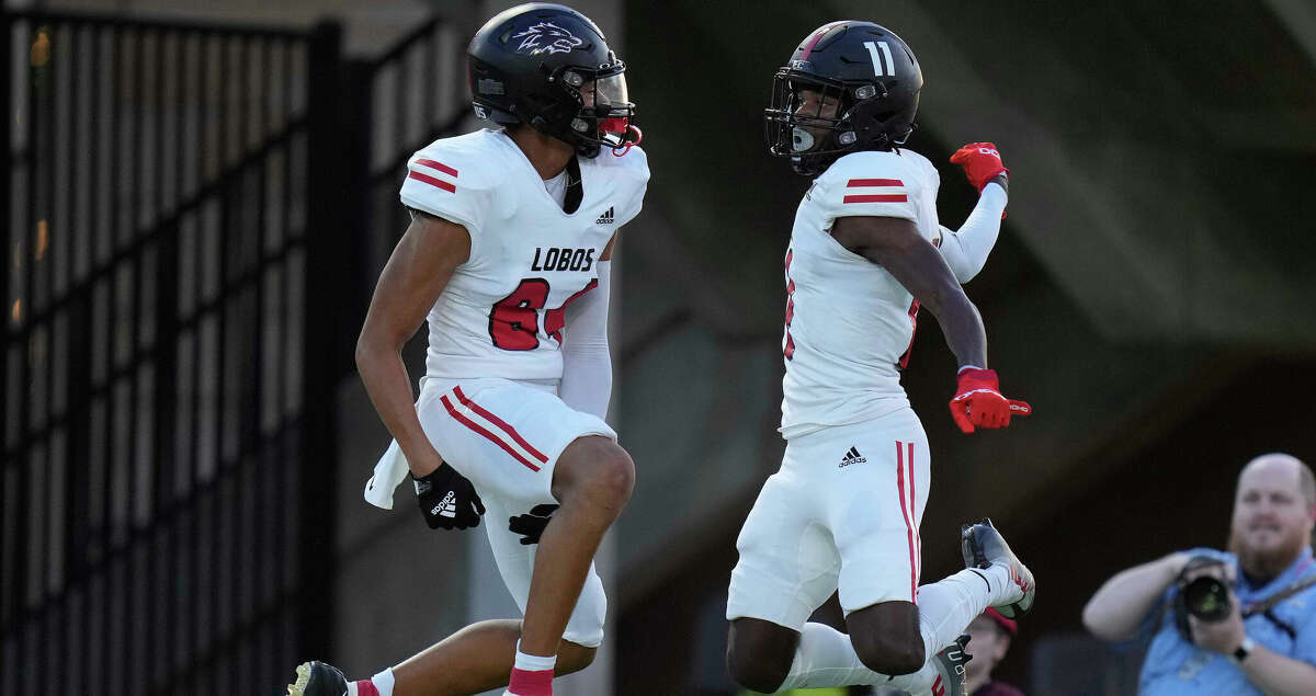 Langham Creek wide receiver Jaquaize Pettaway (11) celebrates his touchdown with Jordan Washington during the first half of a high school football game against Bridgeland, Friday, Sept. 16, 2022, in Cypress.