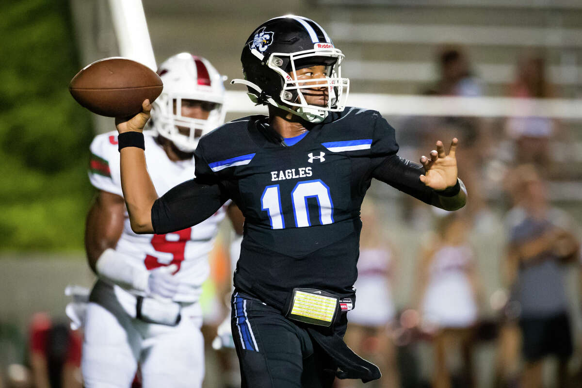 New Caney quarterback Nehemiah Broussard (10) attempts a pass in a district high school football game between The Woodlands and New Caney Friday, Sep 16, 2022, in New Caney.