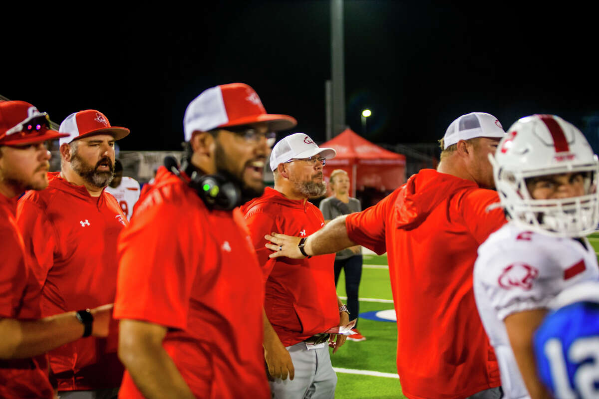 Crosby Cougars coaches react to Barbers Hill players celebrating close the team in a high school football game, District 8-5A Division I game Crosby at Barbers Hill at Mont Belvieu in Humble, TX, September 16, 2022. Barbers Hill defeated Crosby 28-27 in overtime.
