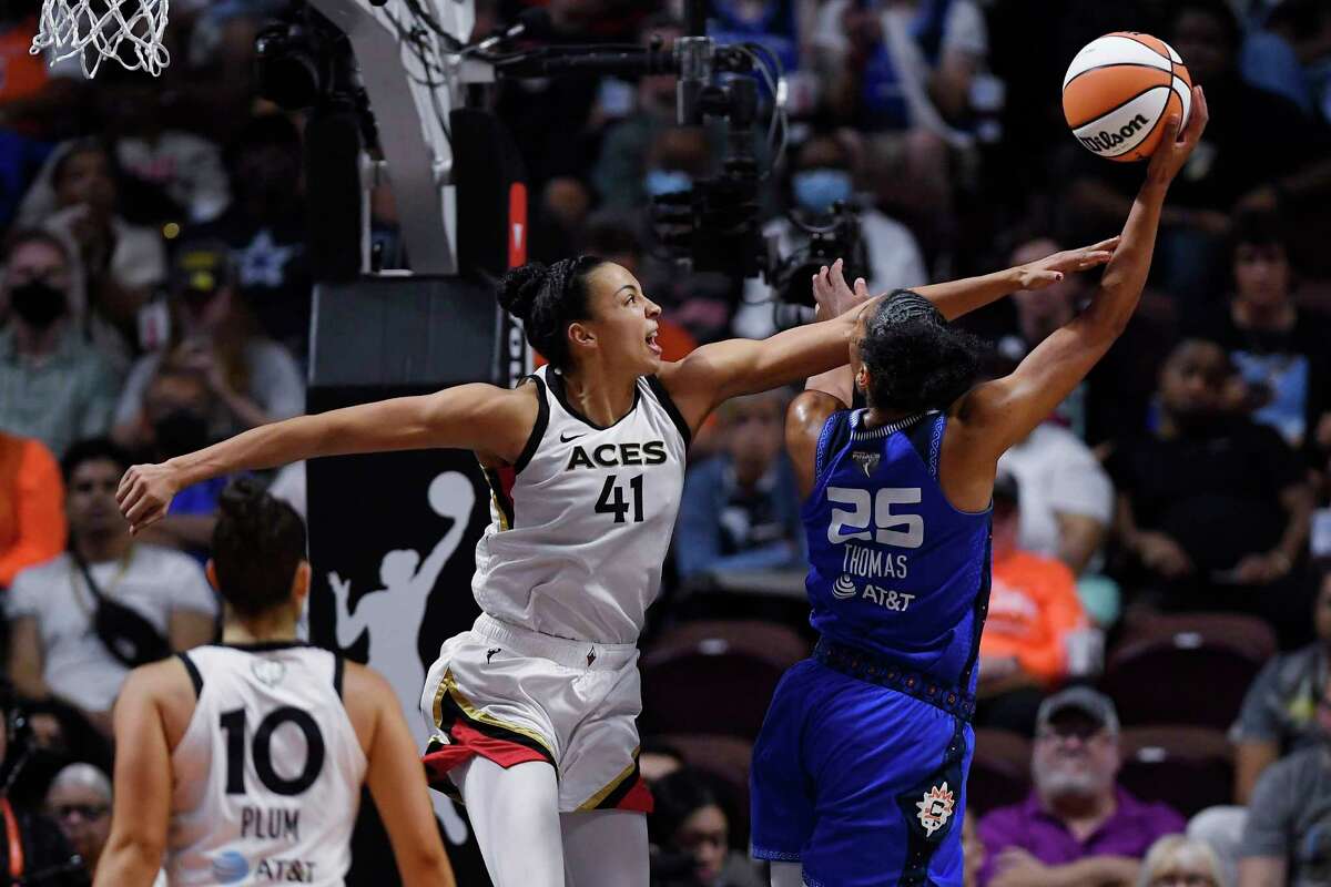 Connecticut Sun's Alyssa Thomas shoots as Las Vegas Aces' Kiah Stokes (41) defends during the second half in Game 3 of basketball's WNBA Finals, Thursday, Sept. 15, 2022, in Uncasville, Conn.