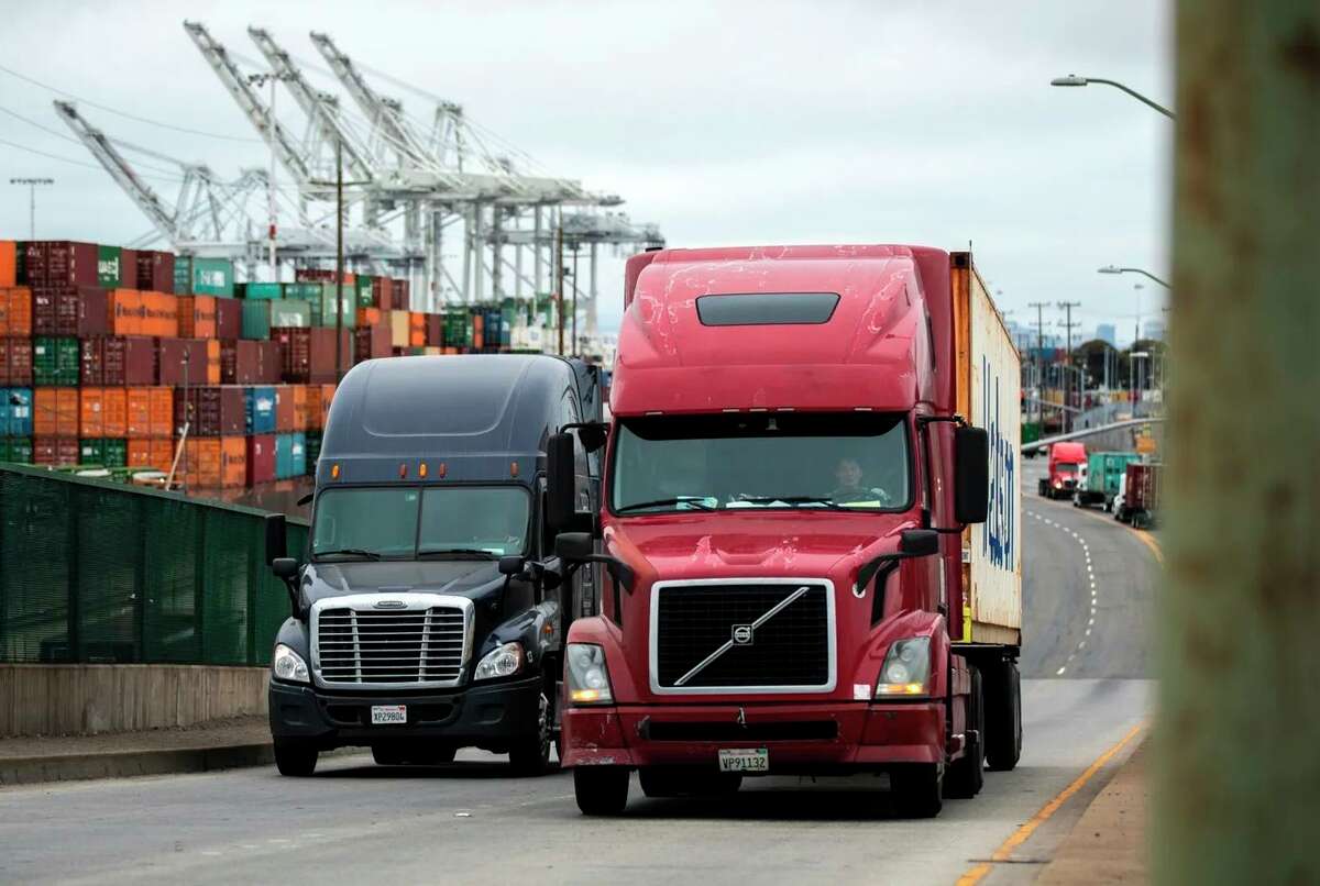 Shipments of cargo leave the Port of Oakland in July. California is scaling up efforts to ban diesel trucks and phase in zero-emission trucks.