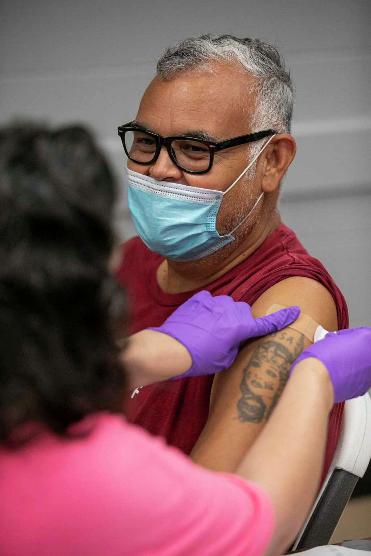 Frank Garret gets vaccinated at a Metro Health vaccination pop-up at the Frank Garrett Multi-Service Center San Antonio in TX, on Sept. 16, 2022. As vaccines become more readily available from commercial pharmacies throughout the city and the pandemic drags on, Metro Health has also shut down their mass vaccine sites and only offers few pop-up sites, one of which had long waits in line to get vaccinated in a limited capacity.