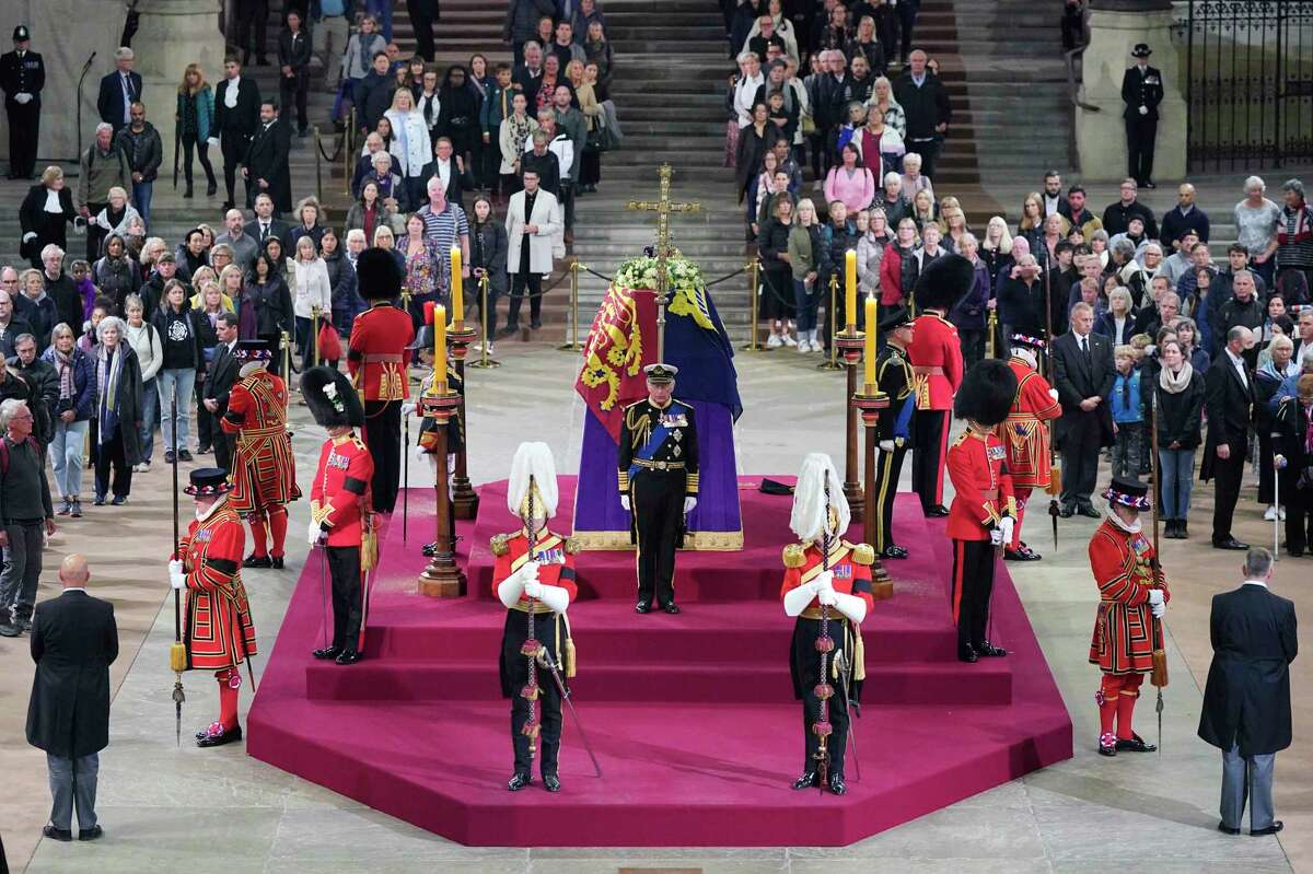 Princes William and Harry hold silent vigil beside Queen Elizabeth II's ...