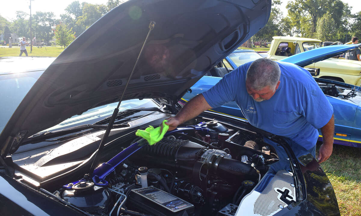 Donald Fry of Palmyra gives his 2013 Camaro SS Supercharger a thorough cleaning during the 38th annual Community Park Car Show. Fry, who said he has “an expensive hobby,” has been a regular at the show and was glad to see it come back after a one-year hiatus. The Morton Ave. Misfits took over sponsorship from the Jacksonville Cruise Nite Association, which had sponsored the show since its inception in 1984.