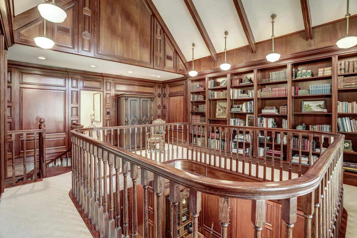 The second floor library looks over the study