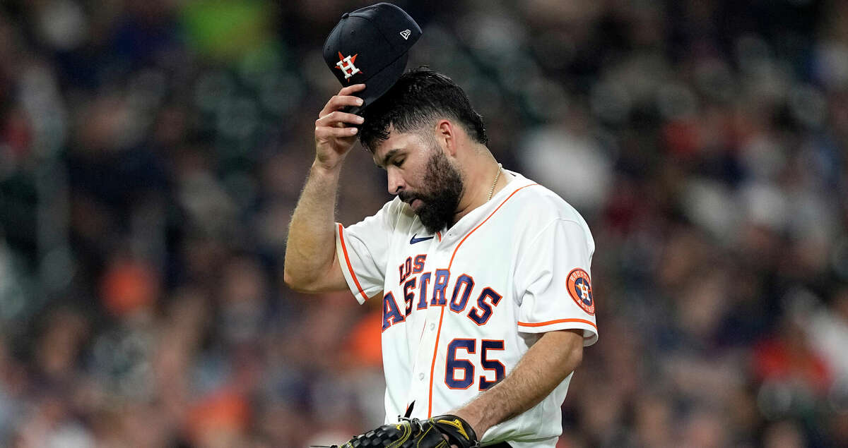 HOUSTON, TX - MAY 22: Houston Astros starting pitcher Jose Urquidy (65)  throws the ball to first base in the top of the first inning during the  baseball game between the Texas