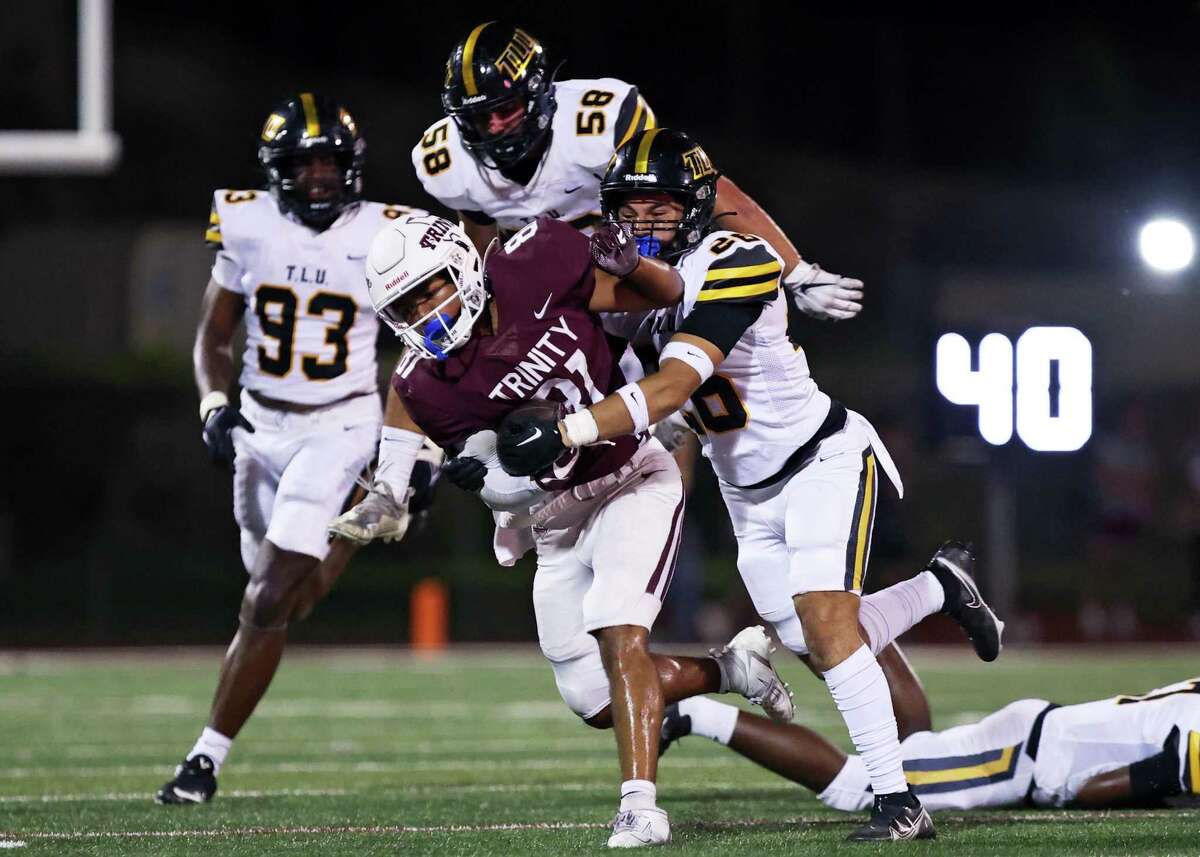 Trinity wide receiver Jackson Williams (81) is tackled during the NCAA Division 3 football game against Texas Lutheran Saturday, Sept. 17, 2022, at Trinity Football Stadium in San Antonio, Texas.