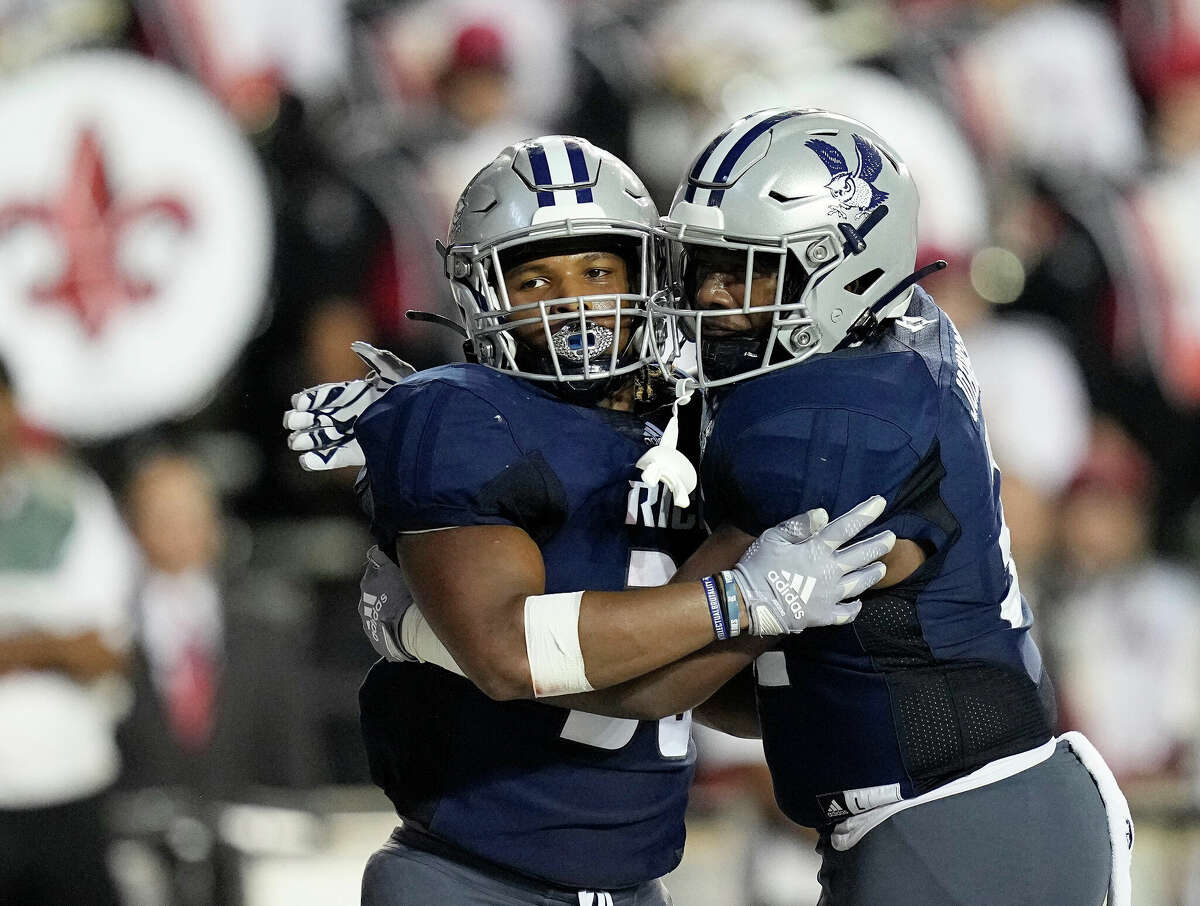 Rice Owls running back Ari Broussard (30) is congratulated by Jerry Johnson III after a touchdown in the fourth quarter of a football game against the Louisiana Ragin Cajuns Saturday, Sept. 17, 2022, in Houston.