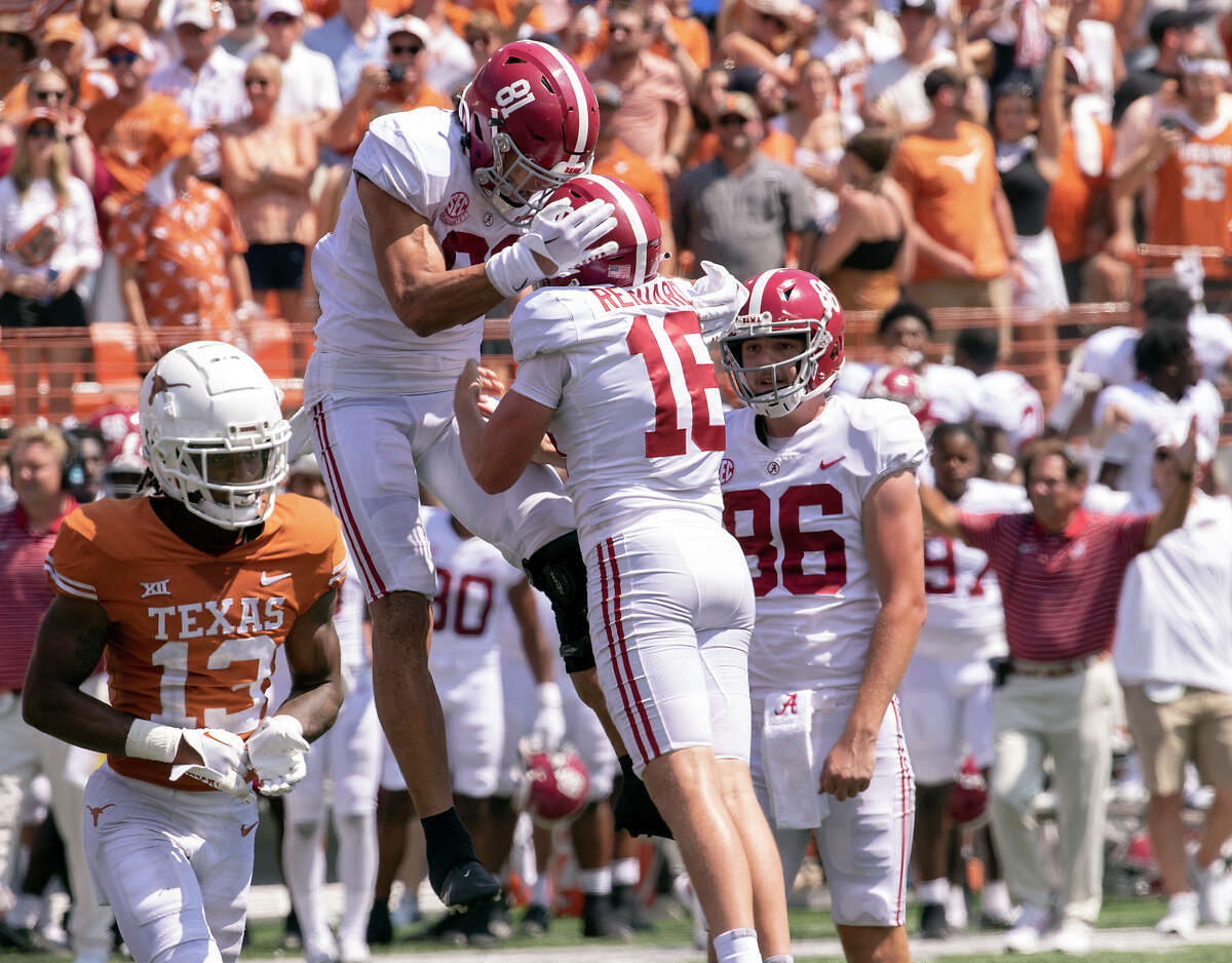 Alabama tight end Cameron Latu (81) celebrates with place kicker Will Reichard and James Burnip (86), after Reichard kicked the game winning field goal as Texas defensive back Jaylon Guilbeau (13) looks on during the second half of an NCAA college football game, Saturday, Sept. 10, 2022, in Austin, Texas. Alabama defeated Texas 20-19.