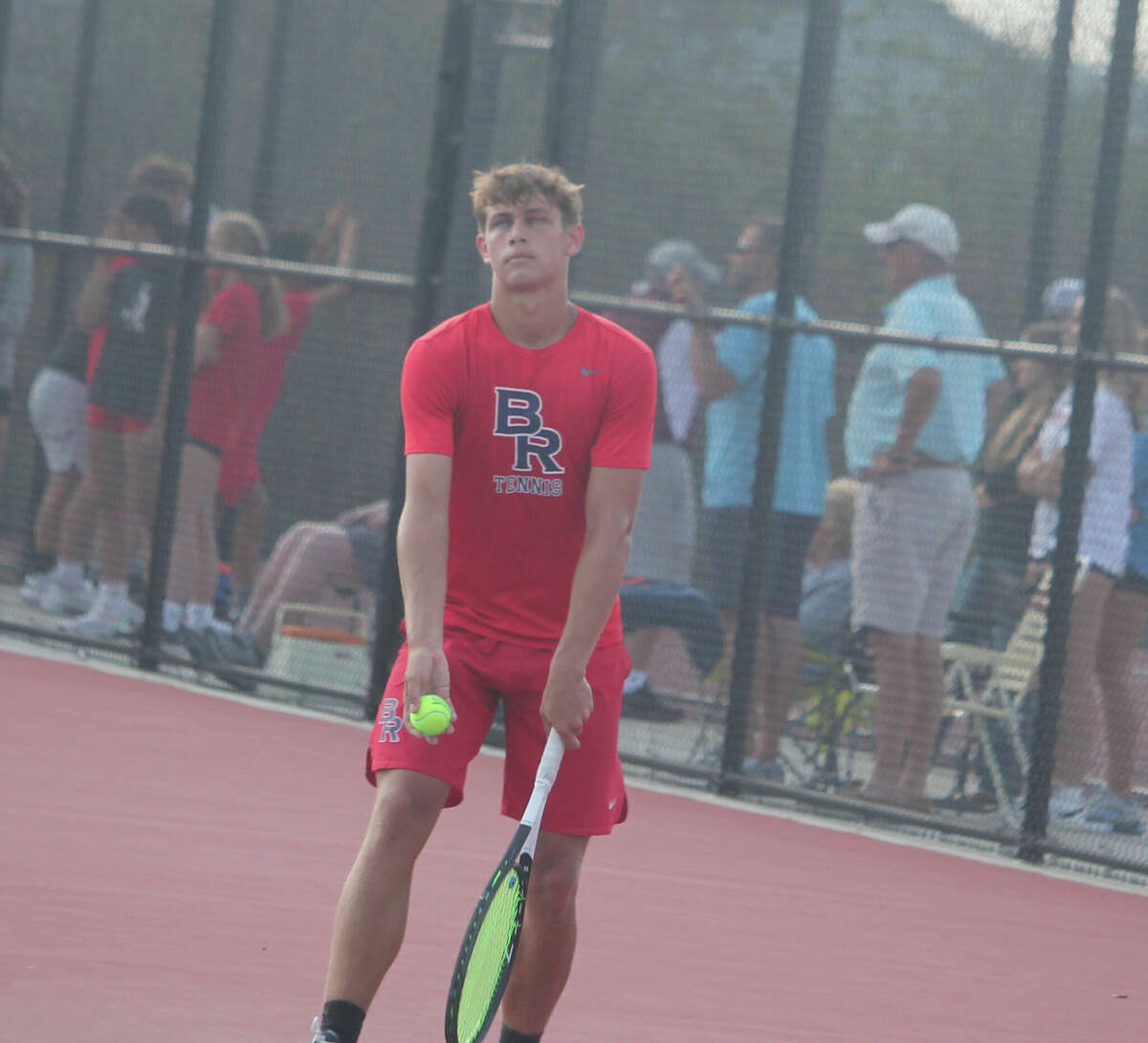 Big Rapids' No. 2 singles tennis player Nate Sanders gets ready to serve against Holland Christian on Thursday.