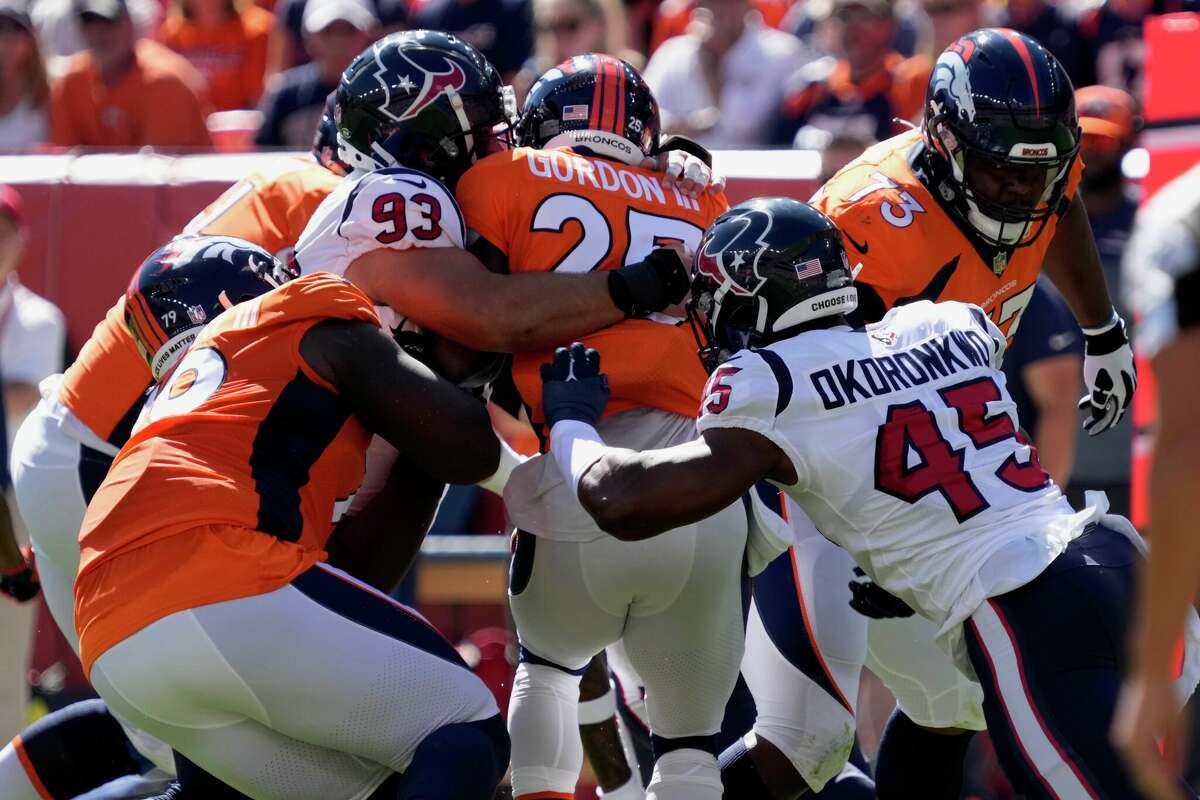 The Texans take down Broncos RB Melvin Gordon III during an NFL football game Sunday, Sept. 18, 2022, in Denver.