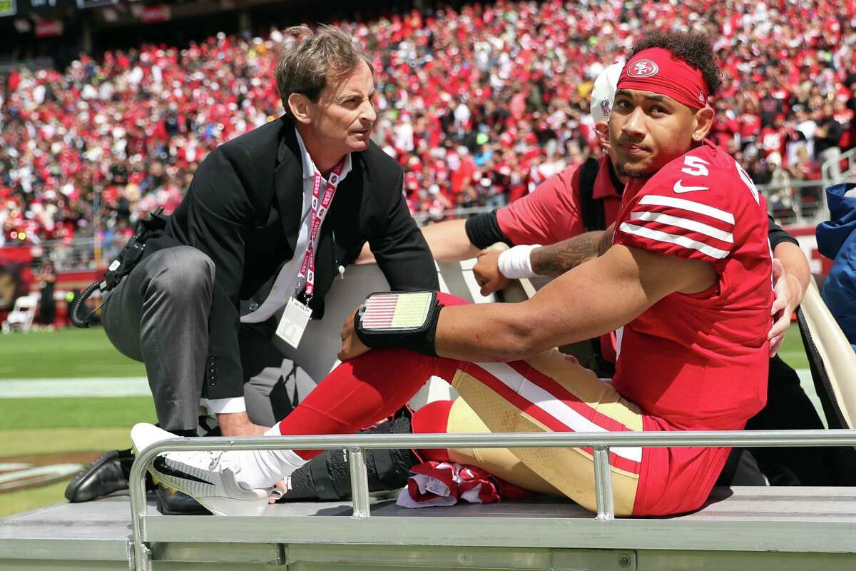 San Francisco 49ers’ quarterback Trey Lance is carted off the field after getting injured in 1st quarter against Seattle Seahawks during NFL game at Levi’s Stadium in Santa Clara, Calif., on Sunday, September 18, 2022.