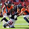 September 18, 2022: Denver Broncos running back Javonte Williams (33)  hurdles Houston Texans cornerback Desmond King II (25) in the football game  between the Denver Broncos and Houston Texans at Empower Field