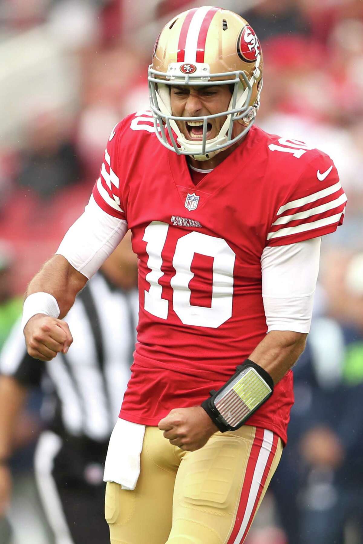 San Francisco 49ers’ Jimmy Garoppolo celebrates touchdown run by Kyle Juszczyk in 2nd quarter against Seattle Seahawks during NFL game at Levi’s Stadium in Santa Clara, Calif., on Sunday, September 18, 2022.