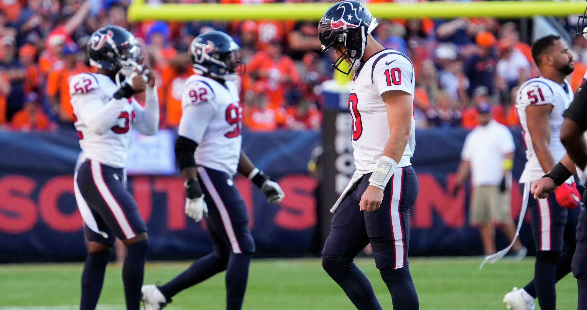 Denver Broncos quarterback Russell Wilson (3) is pressured by Houston Texans  defensive end Jonathan Greenard (52)