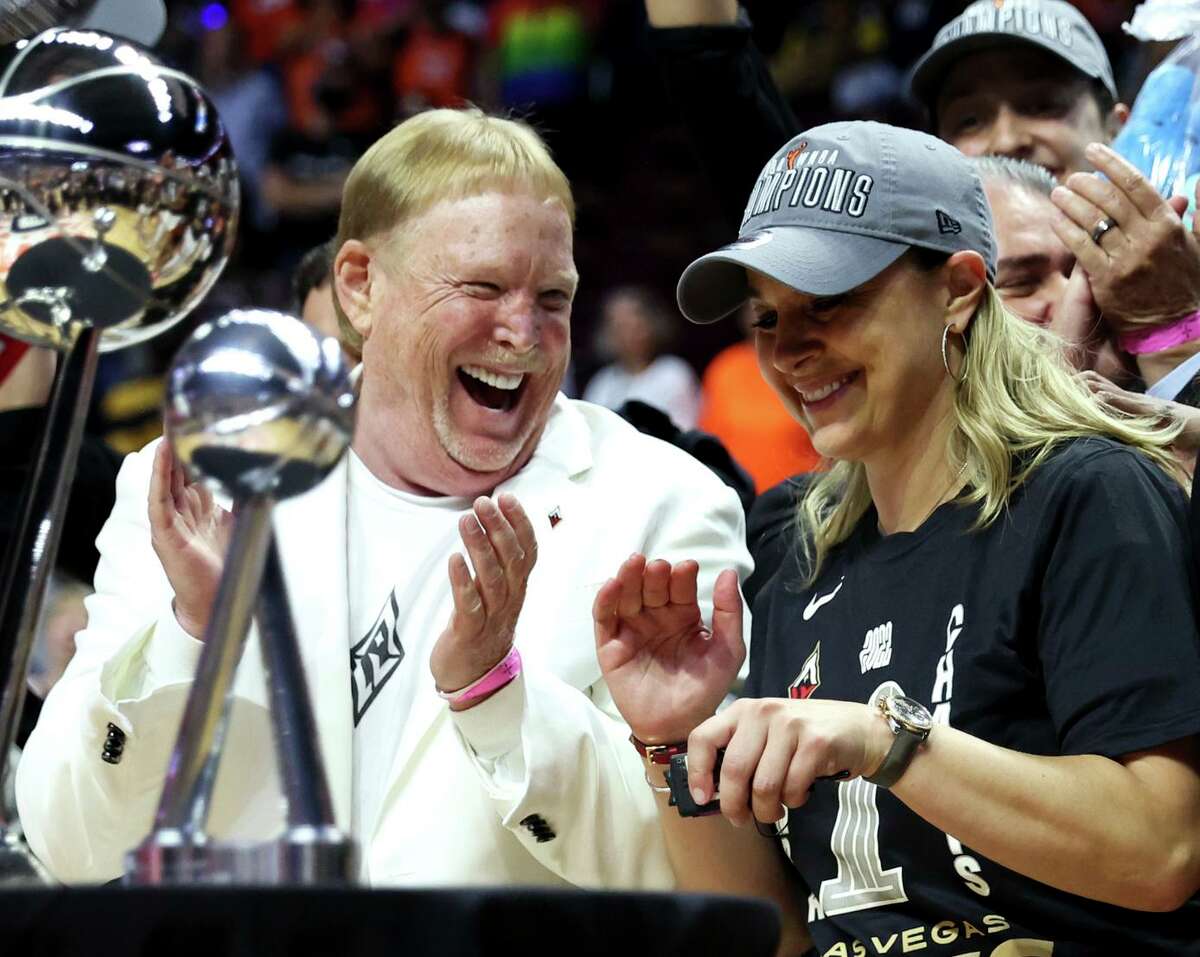 Las Vegas Aces owner Mark Davis celebrates with head coach Becky Hammon after the team’s 78-71 victory over the Sun in Game 4 to win the crown. It was Las Vegas’ first pro sports title.