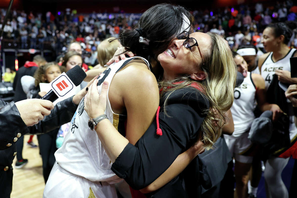 A'ja Wilson #22 of the Las Vegas Aces celebrates with head coach Becky Hammon after defeating the Connecticut Sun 78-71 in game four to win the 2022 WNBA Finals at Mohegan Sun Arena on September 18, 2022 in Uncasville, Connecticut. NOTE TO USER: User expressly acknowledges and agrees that, by downloading and or using this photograph, User is consenting to the terms and conditions of the Getty Images License Agreement.