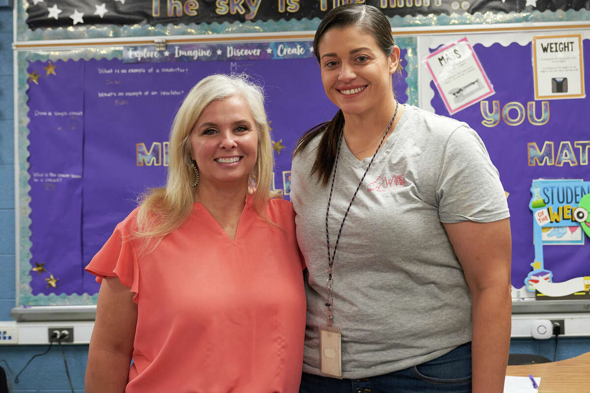 Bowie Fine Arts Academy Principal Melissa Horner, left, poses with fourth grade social studies teacher Taylor Howard at the school Friday, Sept. 9, 2022. Howard, who teaches Texas history, is Horner's former student, who also taught Texas history. TREVOR HAWES/MIDLAND ISD