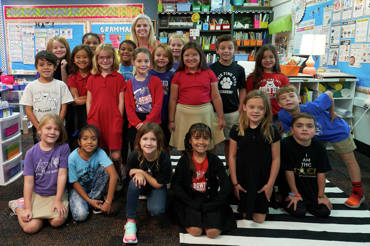 Bowie Fine Arts Academy Principal Melissa Horner, rear, poses with students at the school Friday, Sept. 9, 2022. TREVOR HAWES/MIDLAND ISD