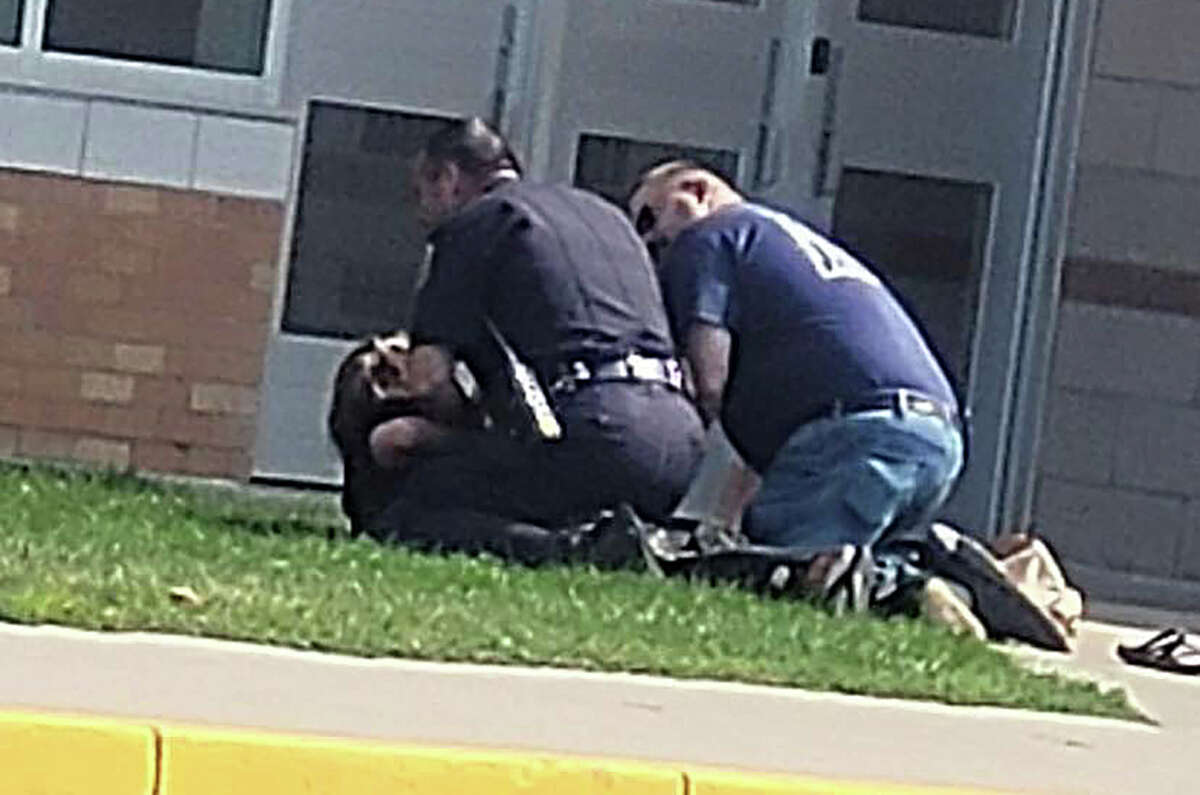 A woman described as "an upset parent" was arrested outside of the K-8 entrance of Harbor Beach Community Schools on Wednesday afternoon. A photo taken of the incident by a student and submitted to the Tribune showed Harbor Beach Police Chief Todd Bucholtz and Harbor Beach Fire Chief Jason Lermont holding a person on the ground with their hands behind their back just outside the school entrance.