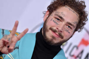 Rapper Post Malone falls off stage in St. Louis