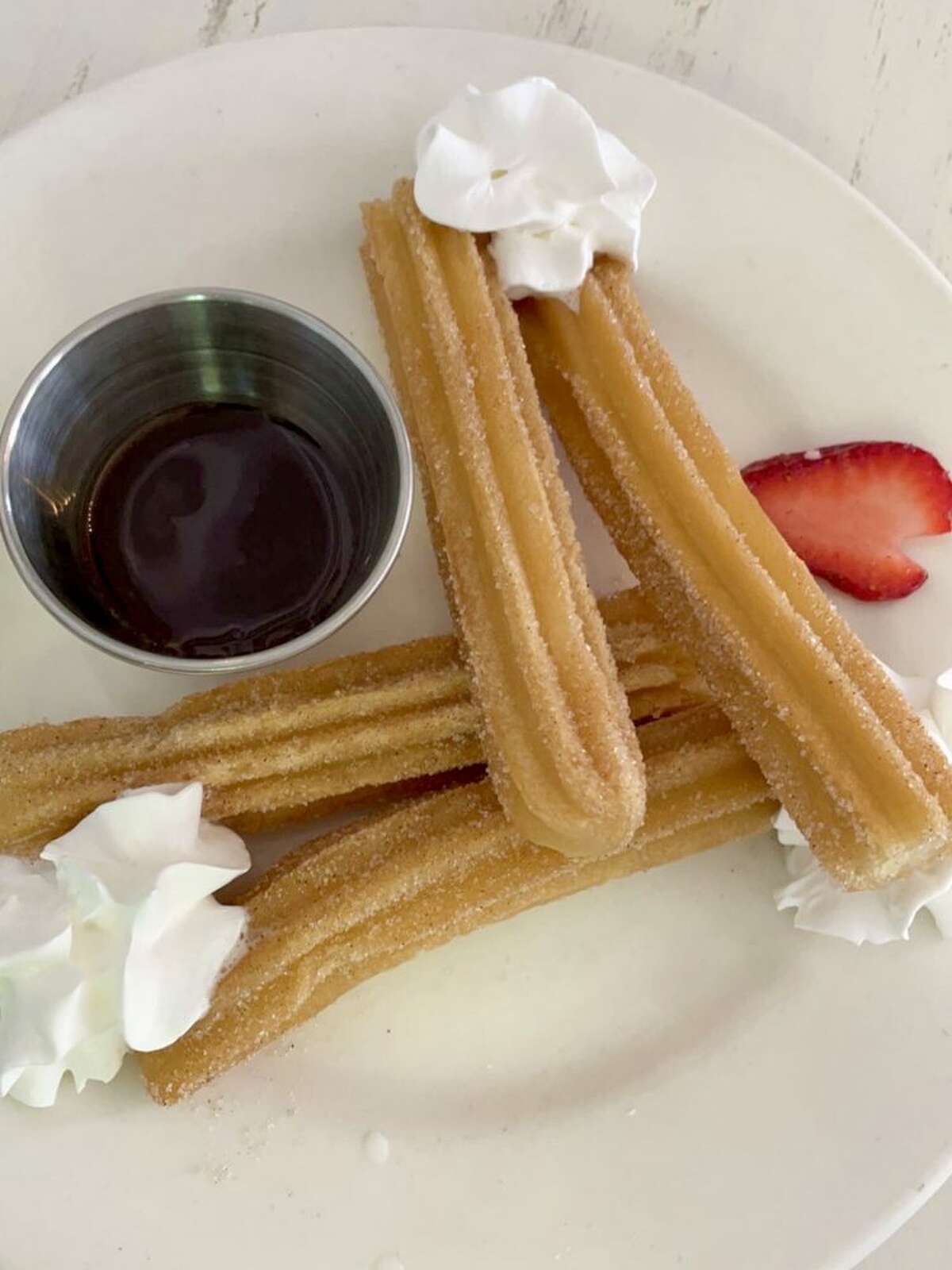 The churros at Cielito Cafe are presented with a chocolate dipping sauce.