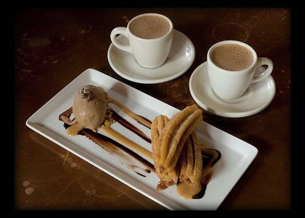 The churro rellenos at Hugo's come with Mexican hot chocolate and homemade ice cream.