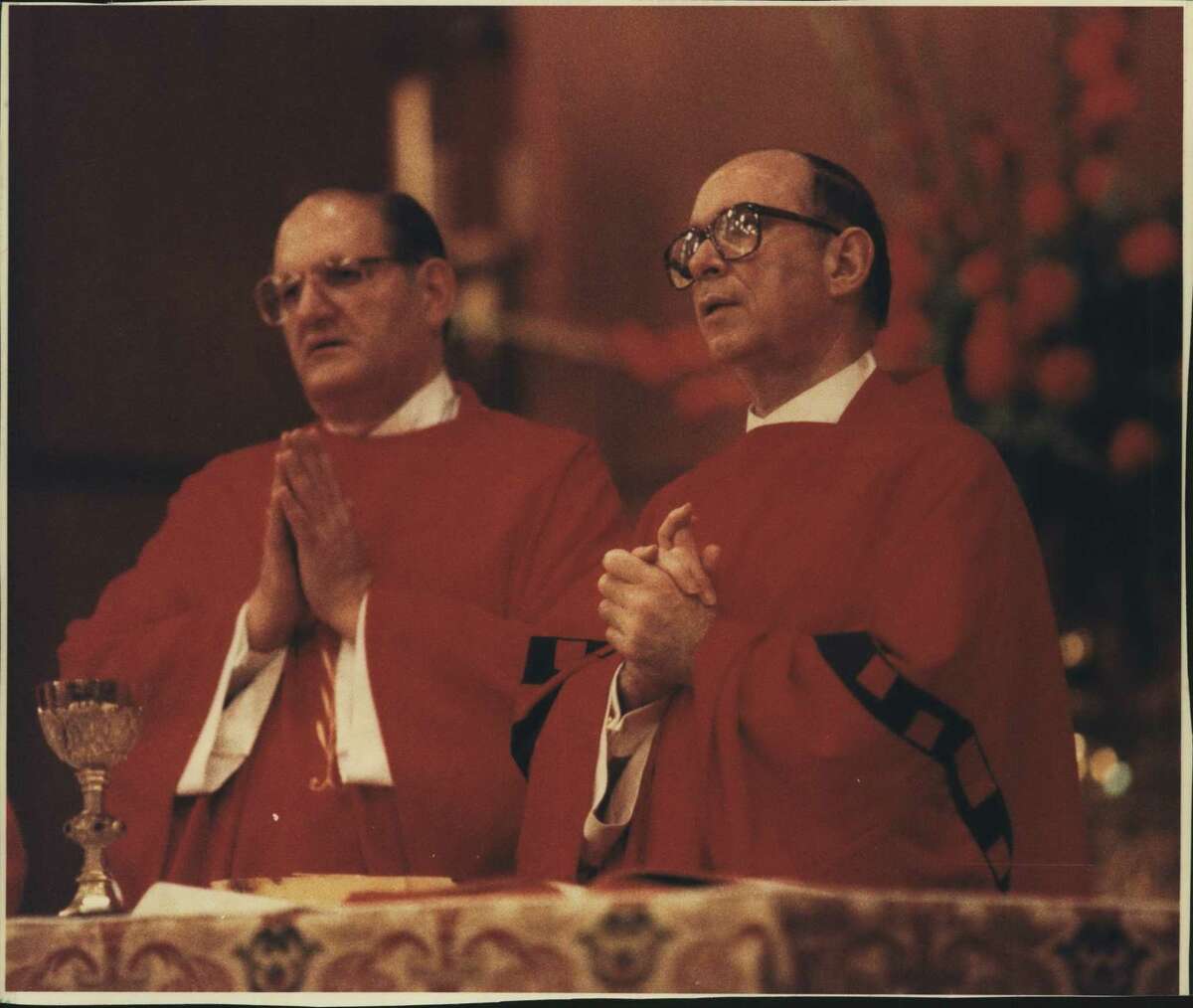 Similar to the way Houston Bishop Joseph Fiorenza, left, and Chicago Cardinal Joseph Bernardin con-celebrated a recent Mass in Houston, some 300 Catholic bishops will con-celebrate Mass daily during next week's conference. Houston, Texas