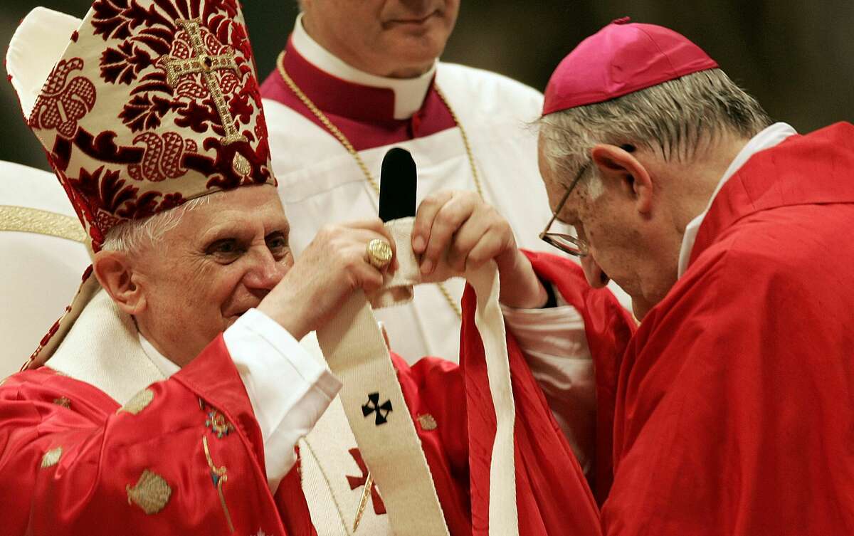 Pope Benedict XVI presents Archbishop of Galveston and Houston, Joseph Anthony Fiorenza, with a Pallium during a solemn mass to celebrate the feast of Saints Peter and Paul in Saint Peter's Basilica at the Vatican City June 29, 2005.