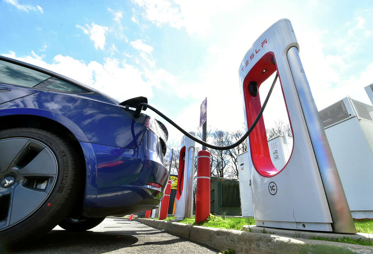 A Tesla charging station at an Interstate 95 rest stop in Fairfield, Conn. The state is getting $52.5 million in federal funding to add more charging stations and devices along major highways, even as Connecticut pushes ahead with a new incentive program for charger purchases for homes and businesses.