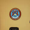 The seal of the state of Michigan hangs in a Huron County courtroom.