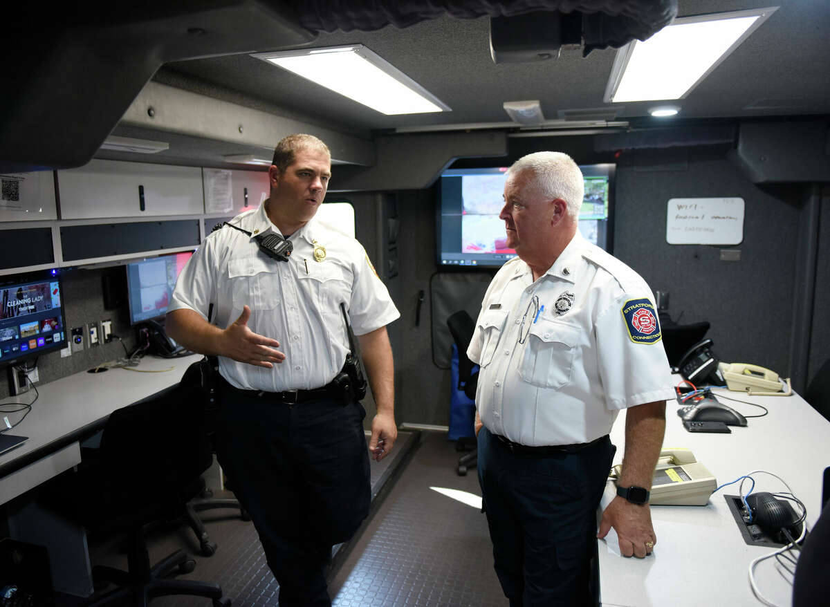 Westport Asst. Fire Chief Matthew Cohen, left, and Stratford Lt. Deputy Fire Marshal State Rep. Ben McGorty, R-Stratford, show the interior of the Fairfield Couty Hadardous Materials Unit command and communications center at the Division of Emergency Management and Homeland Security (DEMHS) Region 1 Preparedness & Response Field Day at Sherwood Island State Park in Westport, Conn. Monday, Sept. 18, 2022. First responders and town officials attended the event to see the advanced technology and mutual aid available to the 14 towns within DEMHS Region 1 that can be utilized in emergency situations. State Homeland Security funds have allowed DEMHS to purchase critical equipment and develop response teams to respond efficiently to emergency incidents of all sizes.