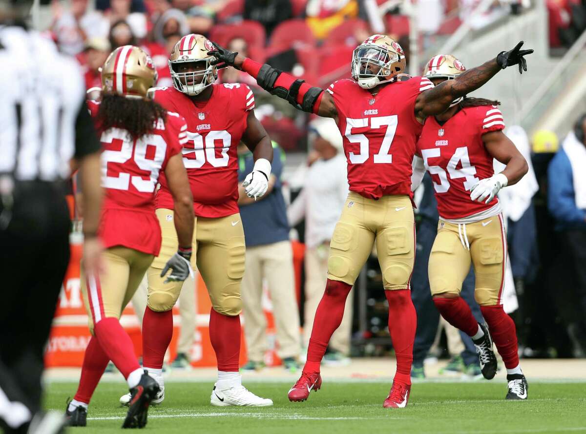 San Francisco 49ers’ Dre Greenlaw celebrates a tackle in 2nd quarter against Seattle Seahawks during NFL game at Levi’s Stadium in Santa Clara, Calif., on Sunday, September 18, 2022.