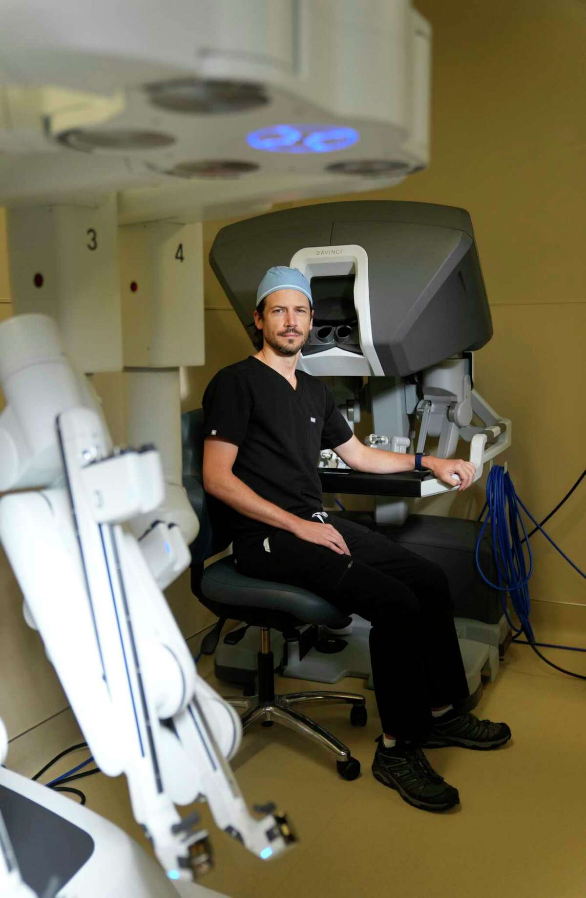 Dr. Paul Smith is shown with the da Vinci Surgical System for robotic-assisted surgery at Memorial Hermann Wednesday, Sept. 14, 2022, in Katy.