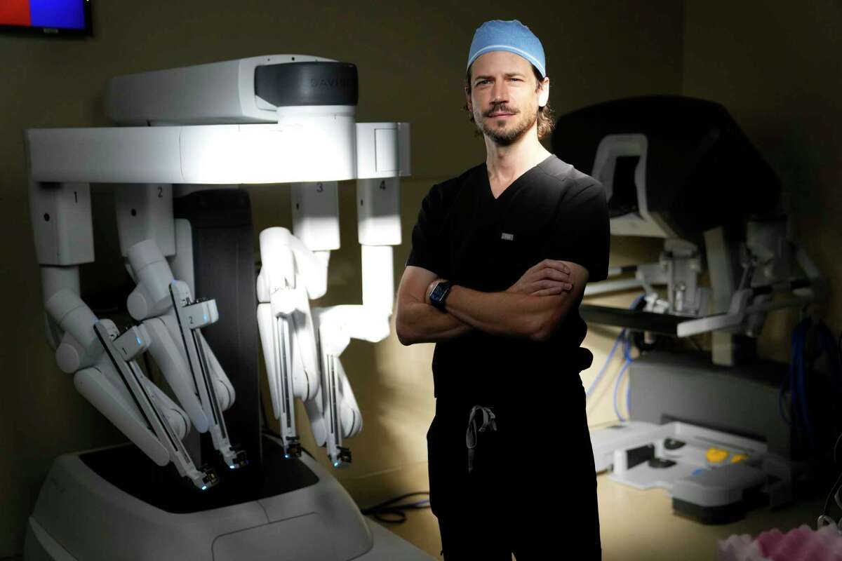 Dr. Paul Smith is shown with the da Vinci Surgical System for robotic-assisted surgery at Memorial Hermann Wednesday, Sept. 14, 2022, in Katy.