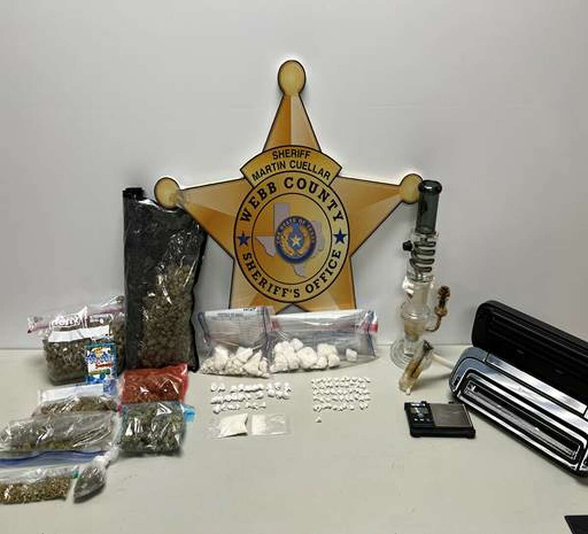 The Webb County Sheriff's Office seized these narcotics and drug paraphernalia after raiding a home on Sept. 14 in the 3900 block of Barcelona Avenue.