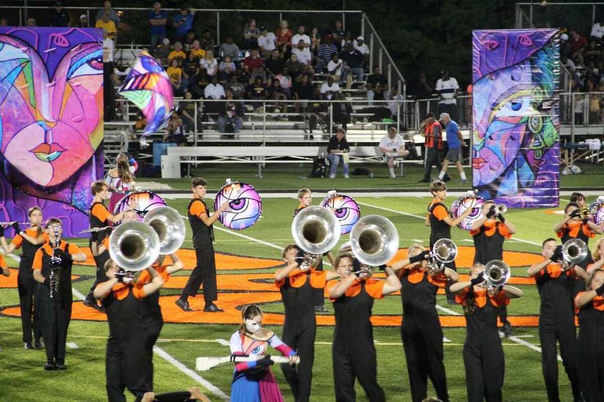The Edwardsville Marching Tigers perform an exhibition of their 2022 show "To describe her..." during the 14th annual Tiger Ambush Classic marching competition on Saturday. 