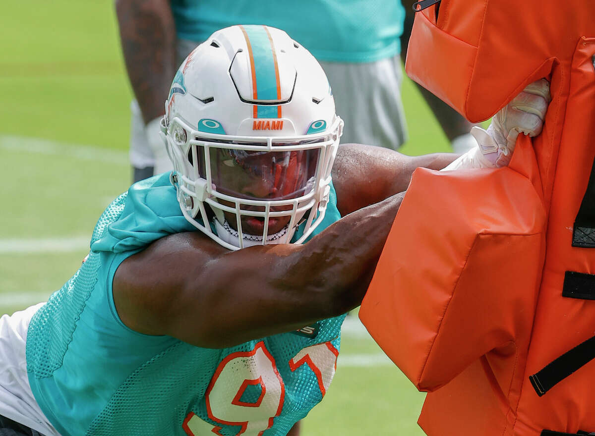 MIAMI GARDENS, FL - AUG 2: Miami Dolphins safety Eric Rowe (20) warms up  during the Miami