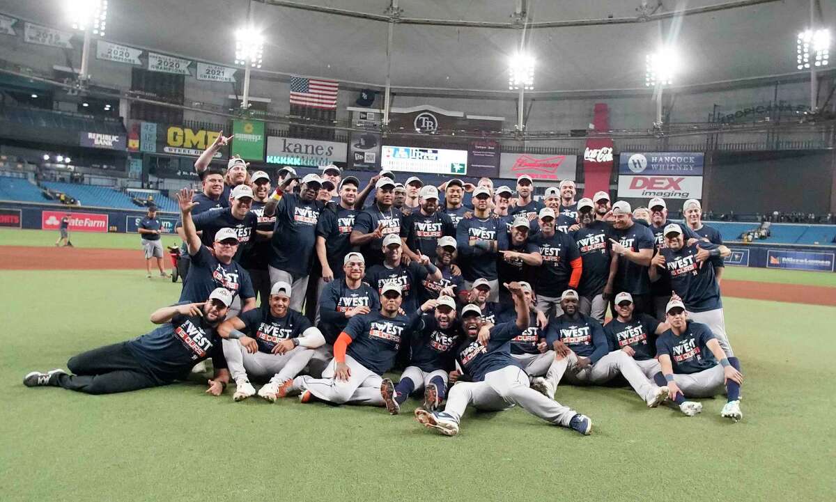 The Astros unite on the turf of Tropicana Field after clinching the AL West title Monday night with a 4-0 victory over the Tampa Bay Rays .