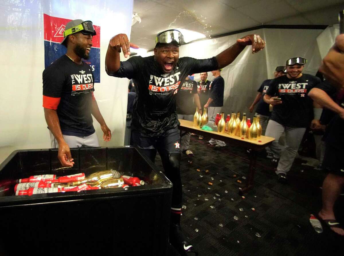 Houston Astros relief pitcher Hector Neris and Houston Astros starting pitcher Cristian Javier (53) after they clinched the AL West after beating the Tampa Bay Rays of an MLB baseball game at Tropicana Field on Monday, Sept. 19, 2022 in St. Petersburg.