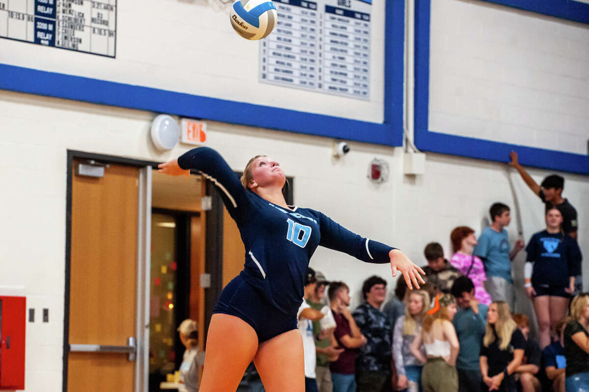 Meridian volleyball player Izabelle Dunn strikes a volleyball on Sept.  19, 2022 at Meridian High School