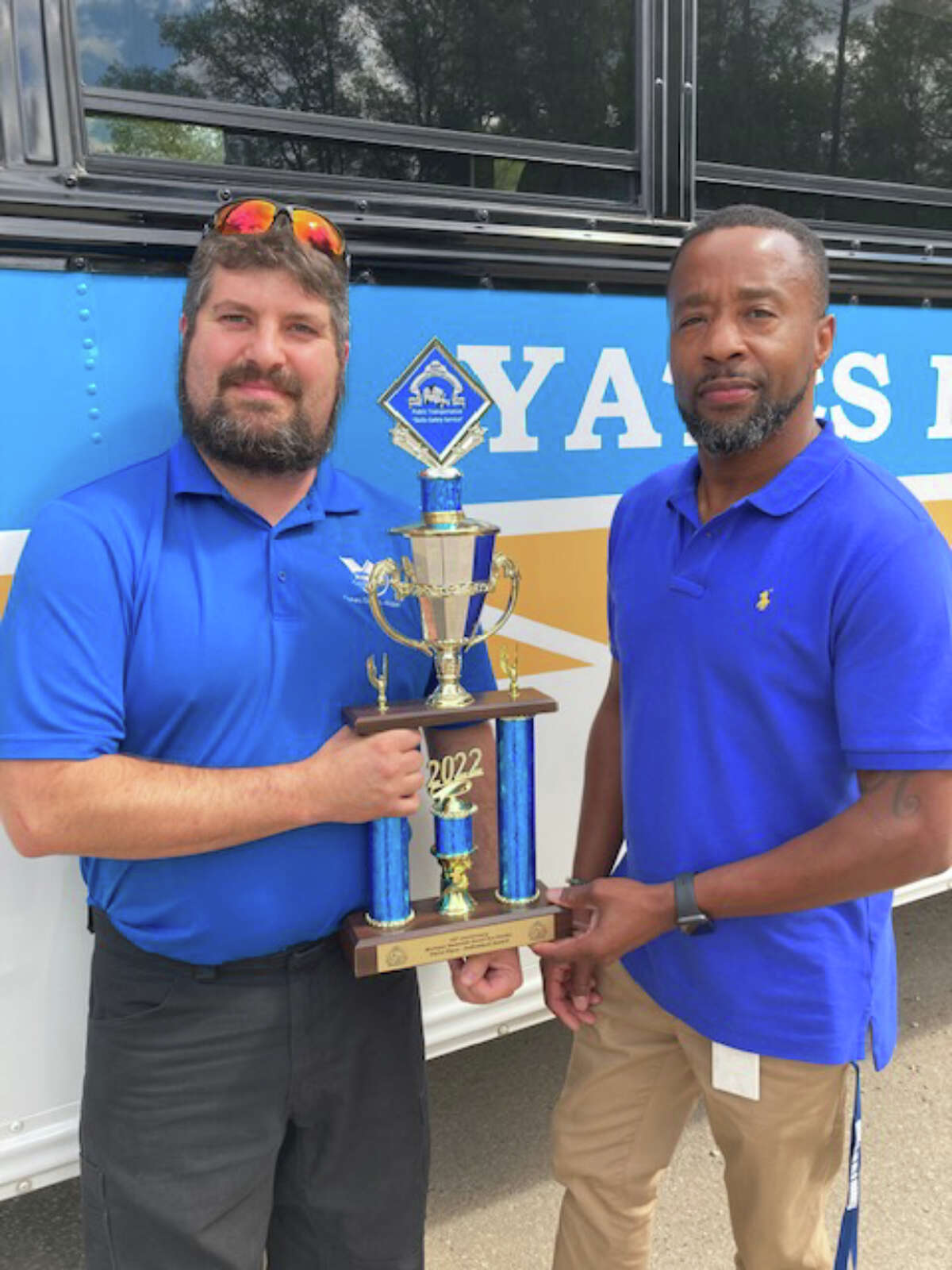 Josh Warner placed third at the 45th Small Bus Rodeo, qualifying him to compete at a national level. Warner (left) is pictured with Yates Dial-A-Ride Executive Director Howard Perry.